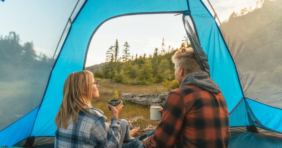 a couple in a tent at a camping